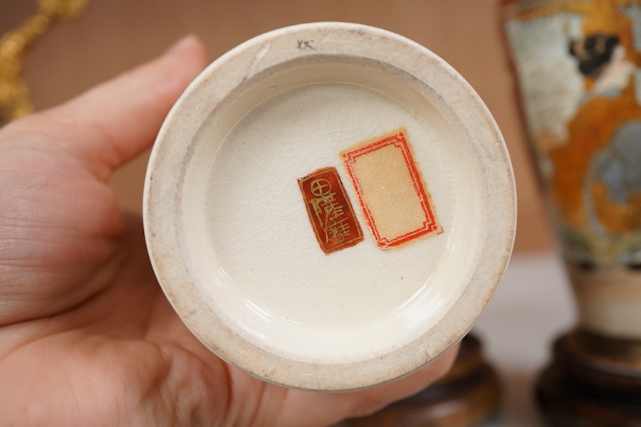 A pair of Japanese satsuma vases and stands, signed, Meiji period (1868-1912), 21cm total